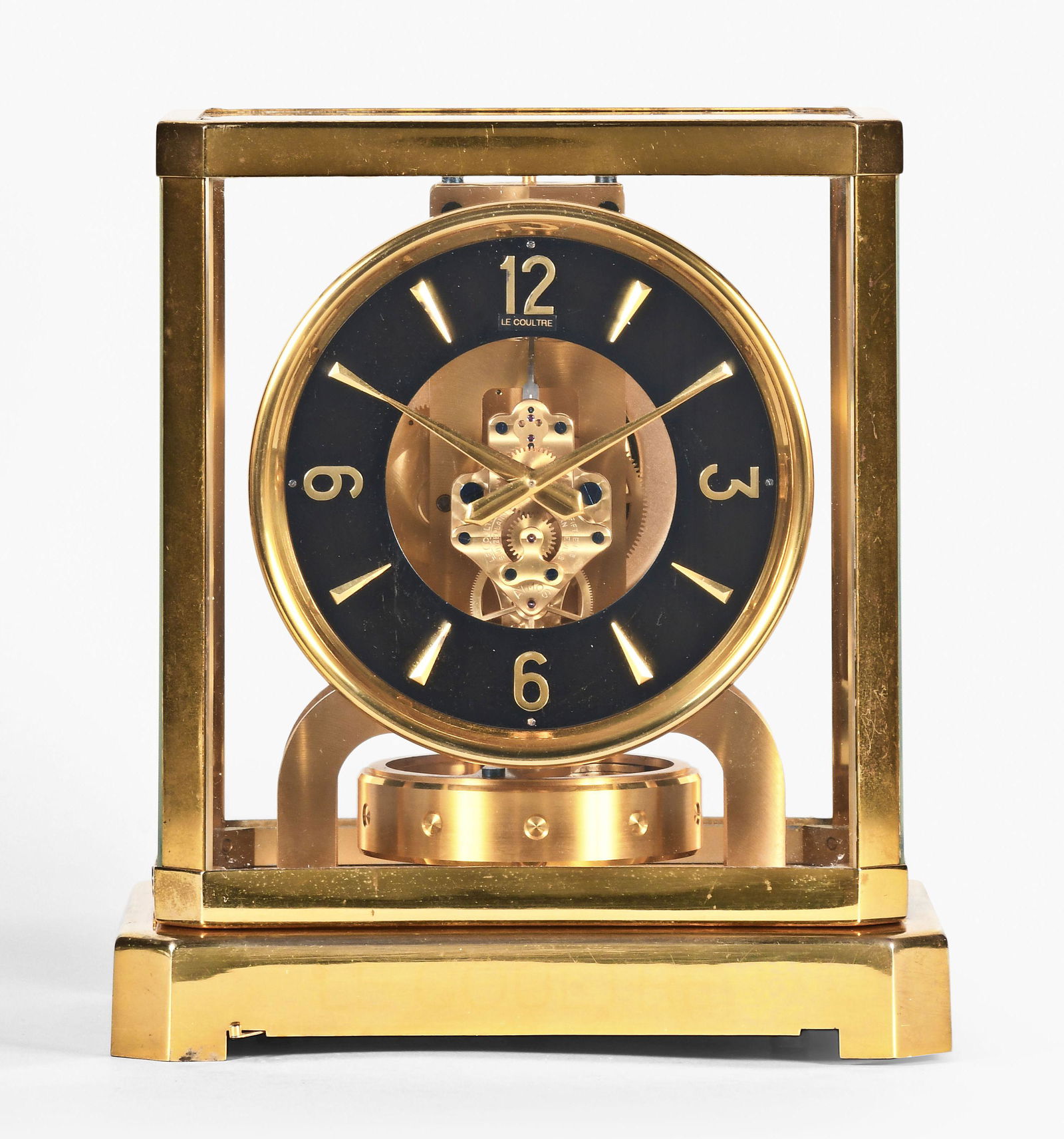 LeCoultre Atmos mantel clock: Jaeger LeCoultre, Switzerland, "Atmos" cal. 519 mantel clock, polished brass case, black painted brass dial, modern style hands, perpetual movement regulated by a torsion pendulum, serial #36203