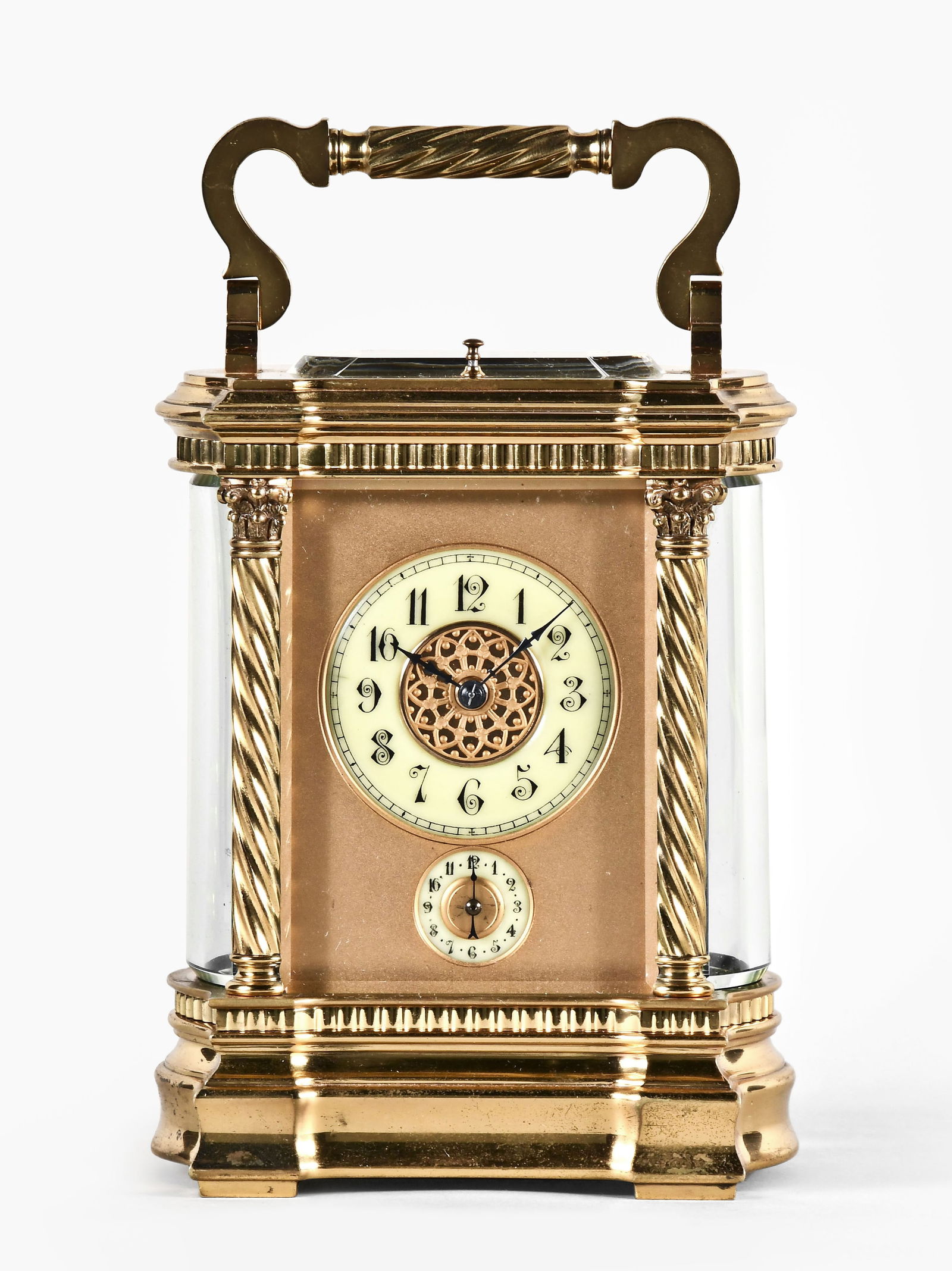 A large Anglaise Riche variant carriage clock with grand sonnerie striking: France, a large Anglaise Riche variant carriage clock, the case with bowed sides, and on a molded base below a narrow, fluted band, the corners with spiral fluted columns with Corinthian capitals, and