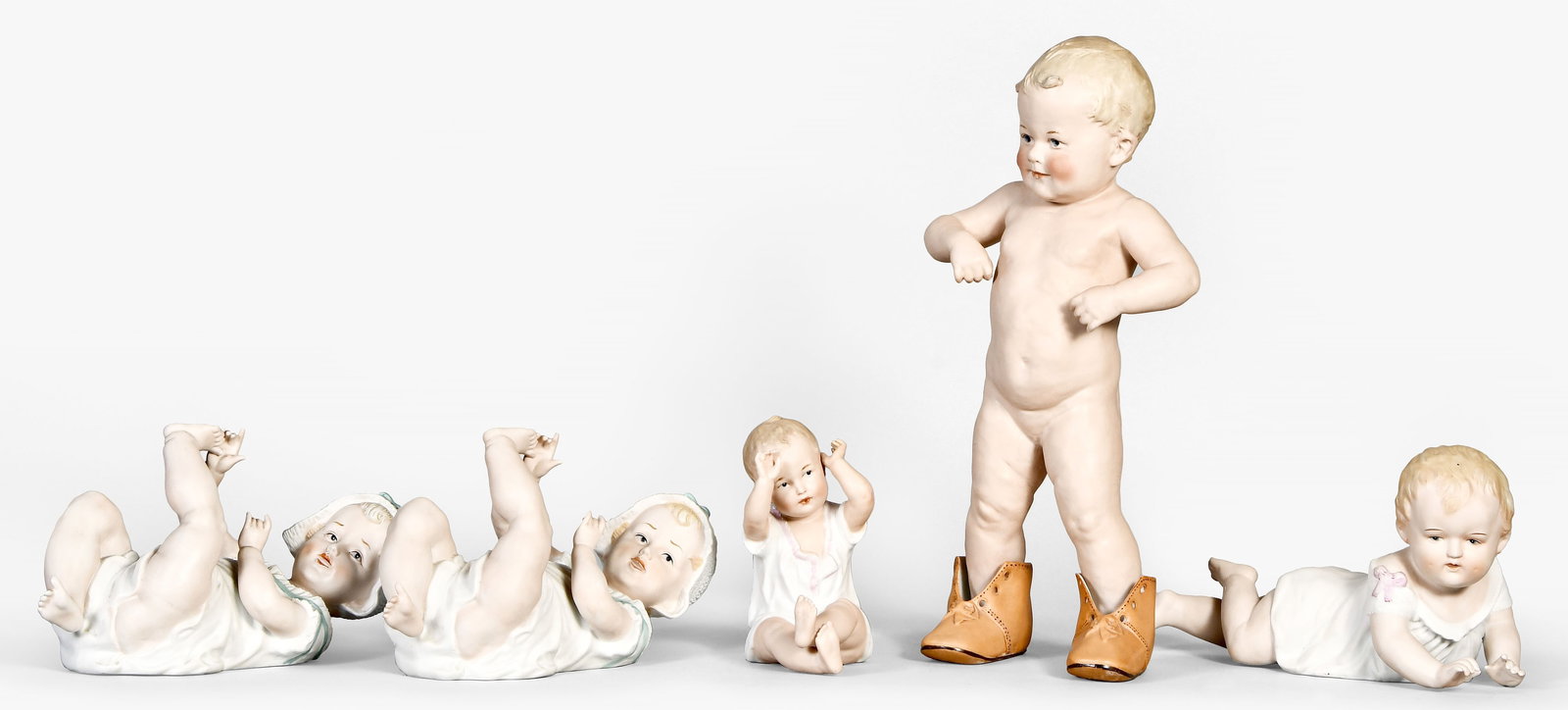 A lot of five German Heubach and Heubach style piano babies (1 of 4)