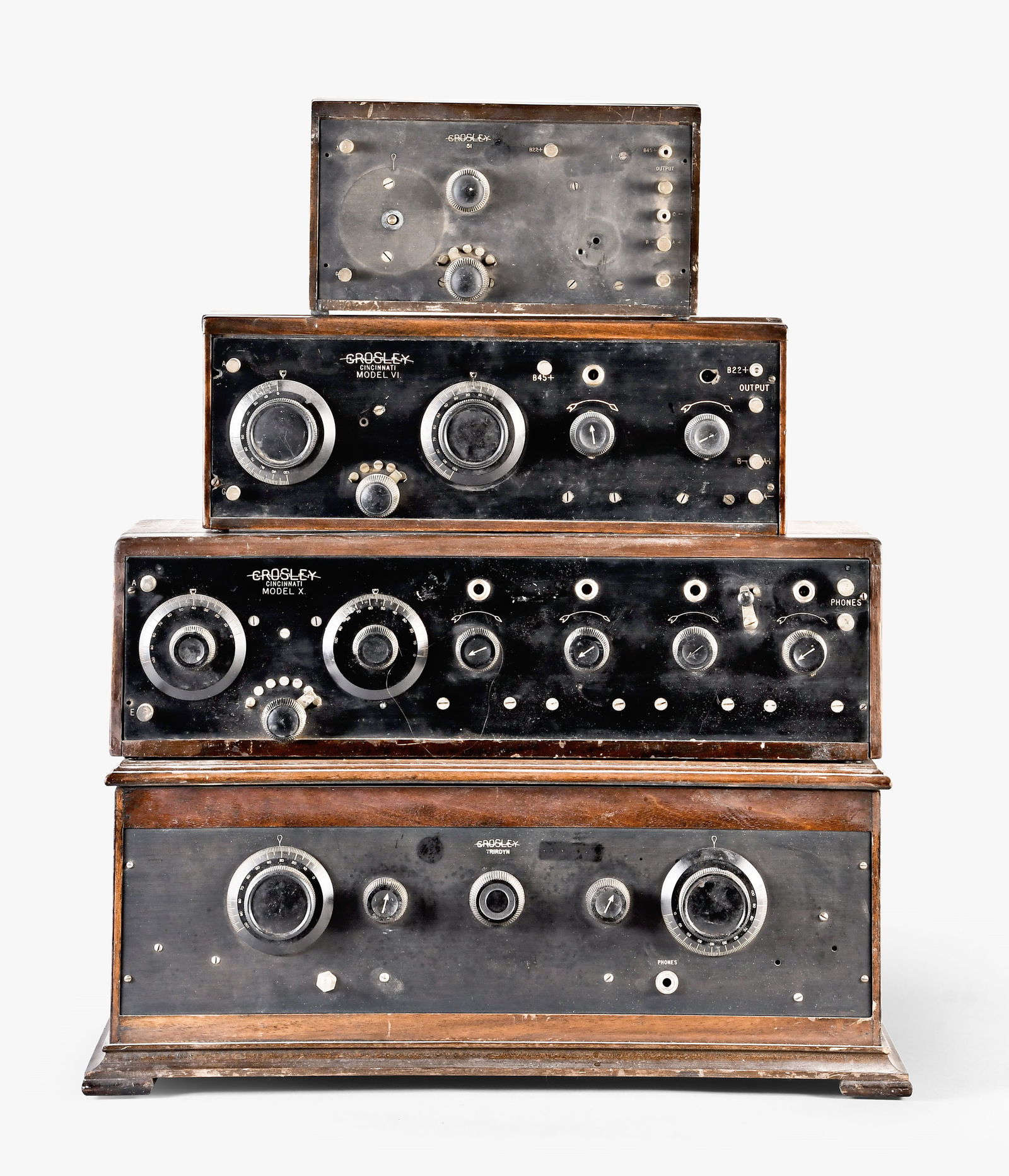 A lot of four Crosley radio receivers: 4 (Four) Crosley, Cincinatti, Ohio radio receivers in wooden cases with bakelite panels and knobs including a Model 6, a Model 10, a Model 5 and a Trirdyn