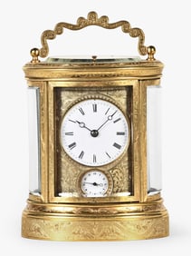 An unusual fourth quarter 19th century French hour repeating engraved oval carriage clock