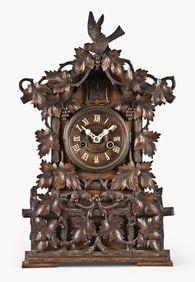 Germany, a late 19th century Black Forest shelf cuckoo and matching wall bracket
