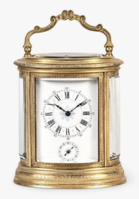 A late 19th century French engraved oval grand sonnerie striking carriage clock
