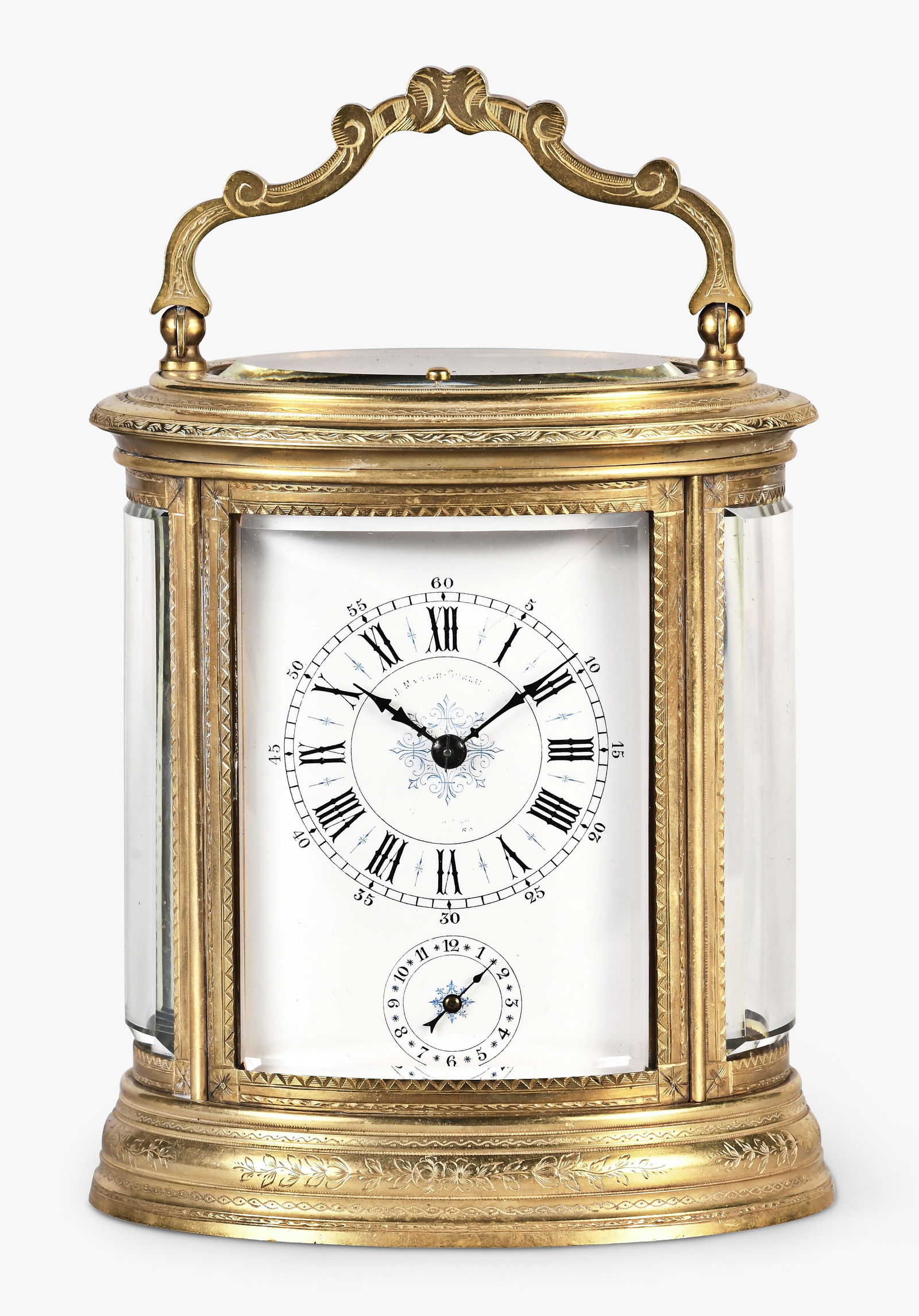 A late 19th century French engraved oval grand sonnerie striking carriage clock: France, a good late 19th century engraved oval grand sonnerie striking carriage clock, molded top and base with five beveled glasses set in engraved frames, the top with engraved, scrolling handle, ro