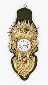 A monumental late 19th century French cartel clock after a design by Jacques Caffieri