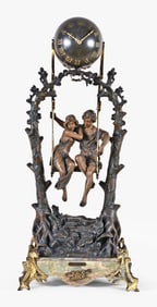 A turn of the 20th century couple on a swing figural mystery clock