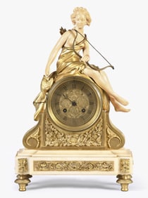 An unusual late 19th century An unusual French chryselephantine figural mantel clock featuring Diana