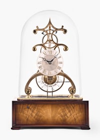 A late 20th century reproduction glass wheel skeleton clock by Gene Chrestensen