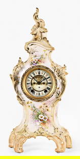 An Ansonia La Grande porcelain mantel clock: Ansonia Clock Co., New York, NY, "La Grande" mantel clock, porcelain case, enameled dial, Fleur de lis hands, eight day spring driven brass time and strike (rack & snail) movement