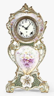 An Ansonia Clock Co. 506 Royal Bonn porcelain mantel clock: Ansonia Clock Co., New York, NY, "506" model mantel clock, Royal Bonn porcelain case with gilded and floral decoration., enameled dial, Fleur de Lis hands, spring driven eight day time and strike move