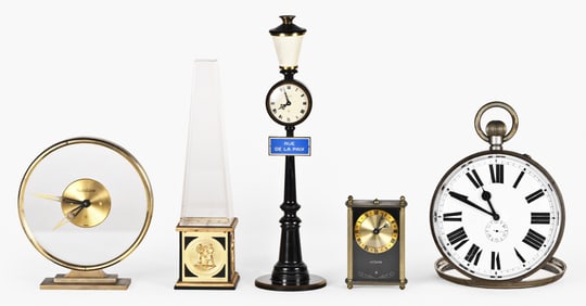 A lot of four Swiss desk clocks and a Goliath pocket watch