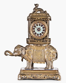A late 19th century elephant form desk clock