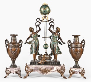A late 19th century French figural swinging mantel clock garniture
