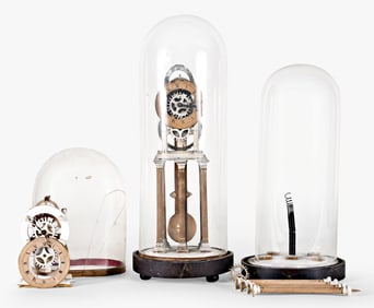 A lot of two mid 19th century French papier mache skeleton clocks by Charles Rouy