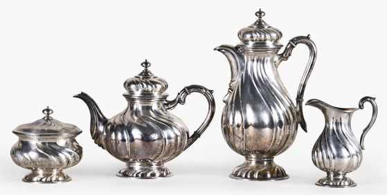 A four piece coin silver coffee and tea service signed Dreyfuss