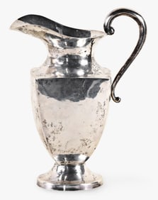 A mid 20th century Mexican silversmith made sterling silver water pitcher