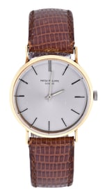 A Patek Philippe movement and dial now in an associated non Patek gold case