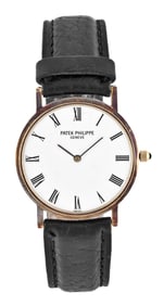 A Patek Philippe movement and dial now in an associated non Patek gold case