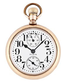 An early 20th century Elgin Father Time pocket watch with wind indicator