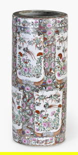 A Japanese Moriage umbrella stand: A Japanese Meiji period porcelain cylindrical umbrella stand with Moriage decoration, eight panels featuring pheasant, butterfly and floral decoration, signed on bottom of base