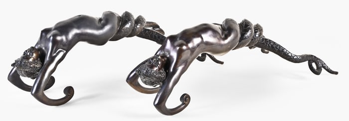 A very decorative pair of late 19th century patinated bronze siren form urn handles