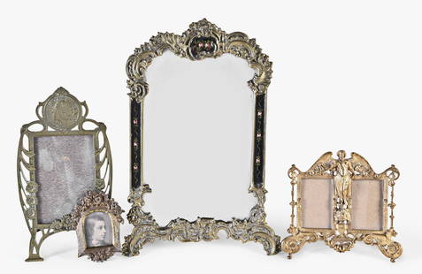 A lot of late 19th - early 20th century decorative brass items: A lot of late 19th - early 20th century decorative brass items, including five mirrors, one round with putto at top, another with black enamel and painted roses, one oval with foliate frame and stand,