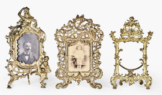 A good lot of six decorative late 19th and early 20th century cast brass picture frames: 6 (Six) decorative late 19th and early 20th century cast brass picture frames, including four in the rococo style, one twig style with acorns and oak leaves, and one with symmetrical scroll and leaf o