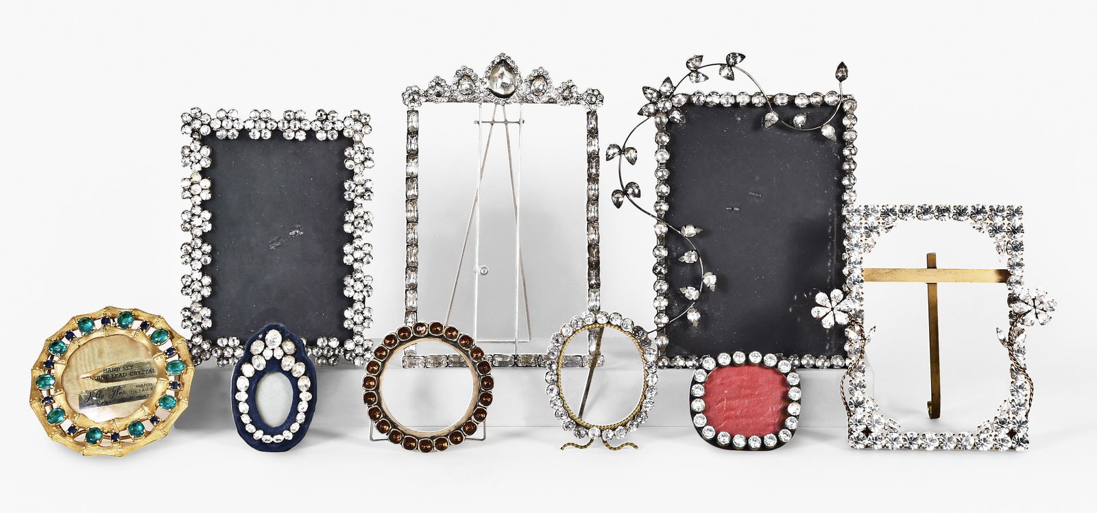 A lot of 20th century brilliant set picture frames: A lot of 20th century brilliant set picture frames in various shapes and sizes, and set with colored and colorless stones, dimensions of larger frame listed
