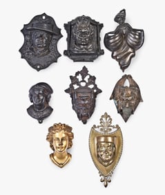 A good lot of eight figural cast iron and bronze match safes