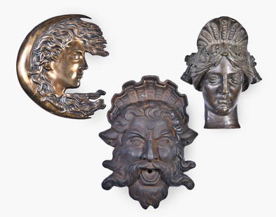 A good lot of three decorative cast iron and bronze masks: 3 (Three) decorative masks, including a cast iron fountain mask of Neptune, a patinated bronze mask of Ceres, and a Woman-in-the-Moon, the figure partially contained by the crescent, Neptune dimension
