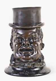A good late 19th - early 20th century European patinated bronze Gent in a Top Hat inkwell