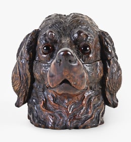 A good early 20th century Black Forest carved linden dog form inkwell