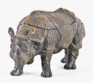 A very unusual late 19th - early 20th century patinated spelter rhinoceros form inkwell