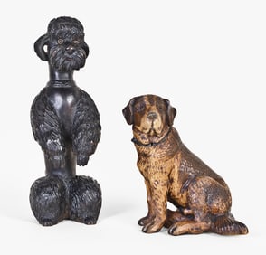 A lot of two early 20th century Black Forest carved dog form inkwells