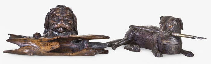 A lot of two good early 20th century Black Forest carved linden dog form inkstands