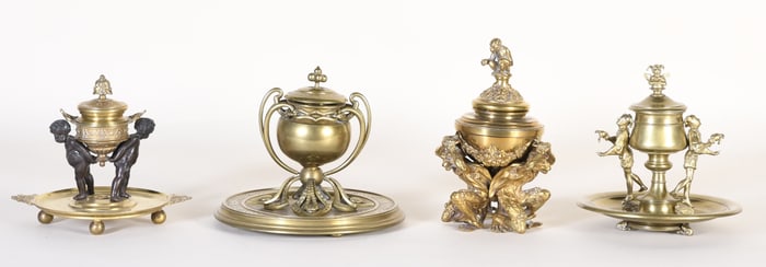 A lot of four late 19th and 20th century decorative brass inkwells