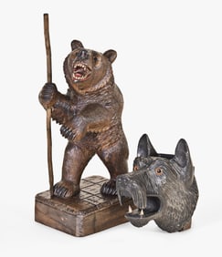 A lot of two early - mid 20th century Black Forest carved bear and dog