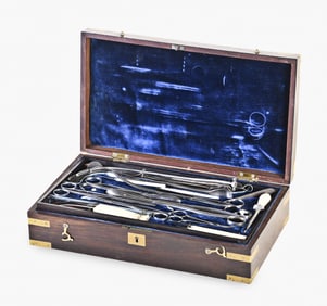 A good mid 19th century boxed surgical instrument set with ivory handles by Rose New York
