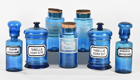 A good lot of seven sapphire blue apothecary jars and bottles