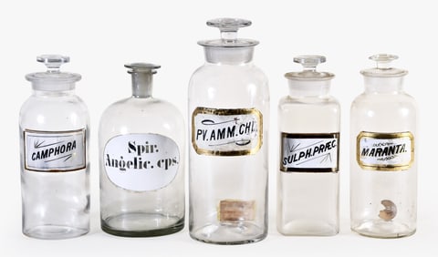 A good lot of fourteen glass and ceramic apothecary bottles and jars including three in cobalt blue