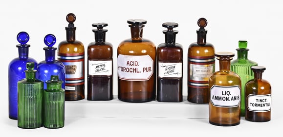 A large lot of late 19th and 20th century apothecary bottles in various colors