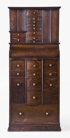 An unusual early 20th century oak dental cabinet