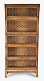 A good early 20th century oak sectional barrister's bookcase with leaded glass doors
