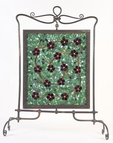 A good early 20th century rotating stained glass fire screen