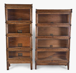 A lot of two early 20th century Globe Wernicke oak sectional barrister's bookcases: A lot of two early 20th century Globe Wernicke oak sectional barrister's bookcases, both with four sections plus top and base, the first a pattern 110 grade 198 with standard D - 10 1/4" units, the ot