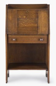 A small early 20th century quarter sawn oak slant front desk by Gustav Stickley