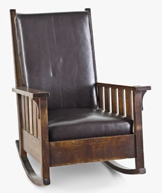 A large early 20th century oak Arts & Crafts style rocking chair attributed to L.& J.G. Stickley