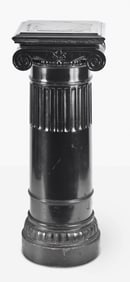 A late 19th - early 20th century ebonized wooden column form display pedestal with rotating top