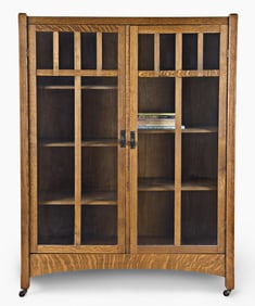 An early 20th century quarter sawn oak Arts & Crafts style bookcase