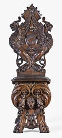 A late 19th century European walnut Escabelle chair with sculptural carving